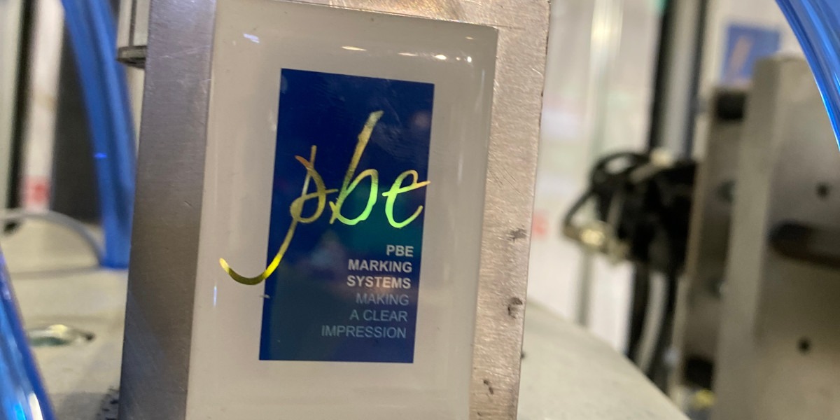 PBE Marking Systems logo on wall